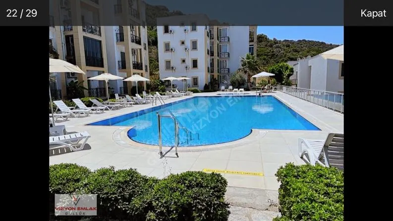 MİLAS GÜLLÜK'TE SUNSET APARTMANLARI SİTESİNDE 2+1 KOMPLE DENİZ HAVUZ MANZARALI DAİRE